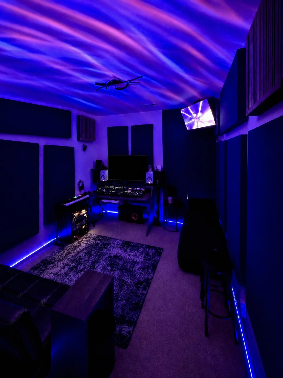 Lunar Mansion Studios full control room with the monitoring position, acoustic treatment, and illuminated production workspace