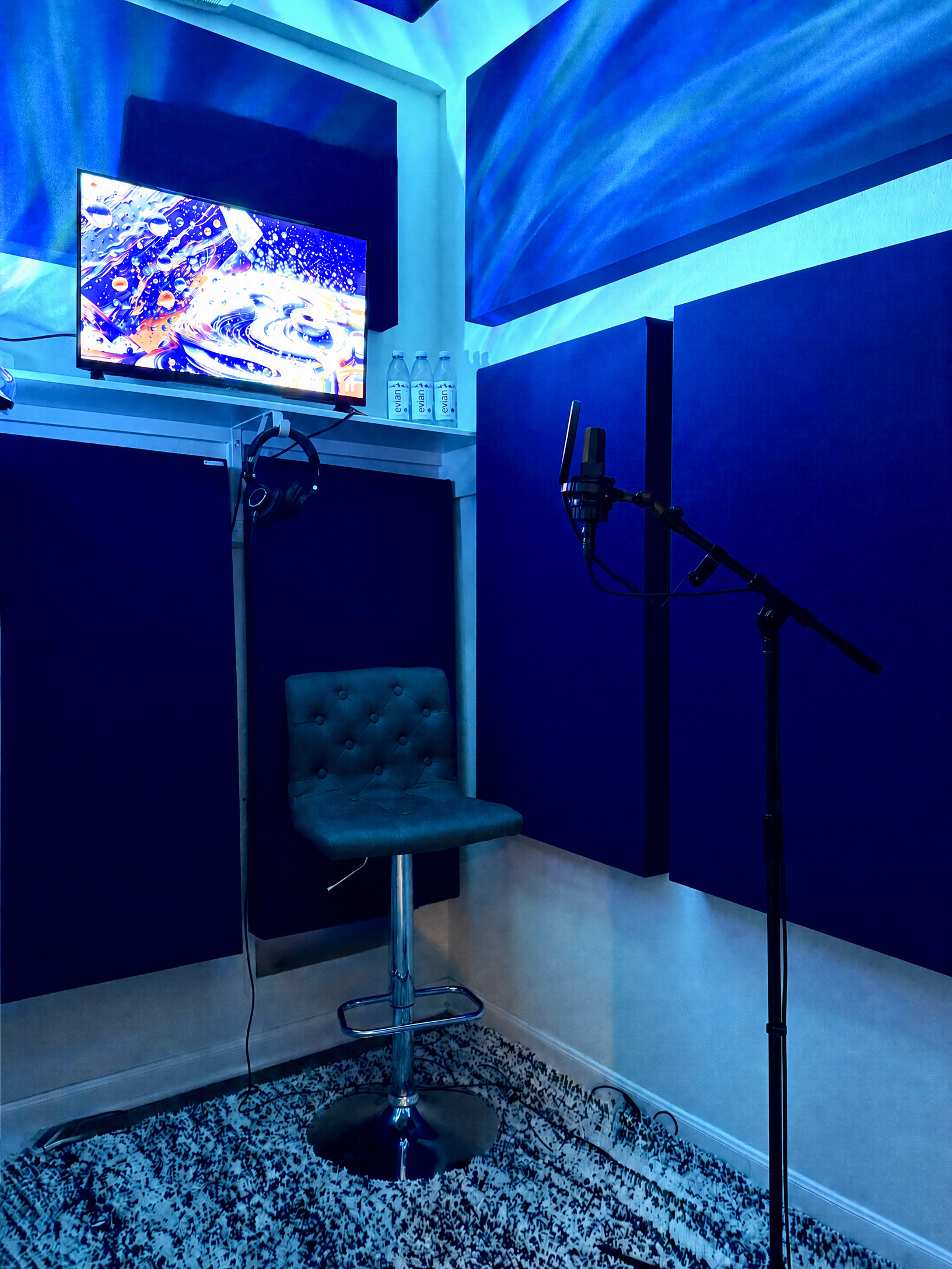 Lunar Mansion Studios vocal suite — acoustically treated vocal recording booth with AKG C414 microphone and ambient LED lighting in West Houston